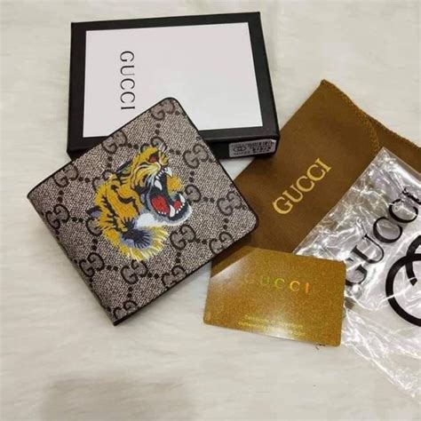 gucci tigre portafoglio|the house gucci tiger.